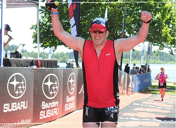 a man holding his arms up