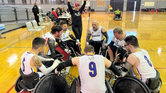 a group of people in wheelchairs