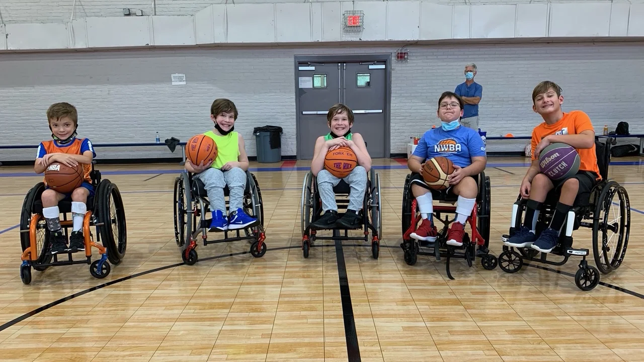 a group of boys in wheelchairs